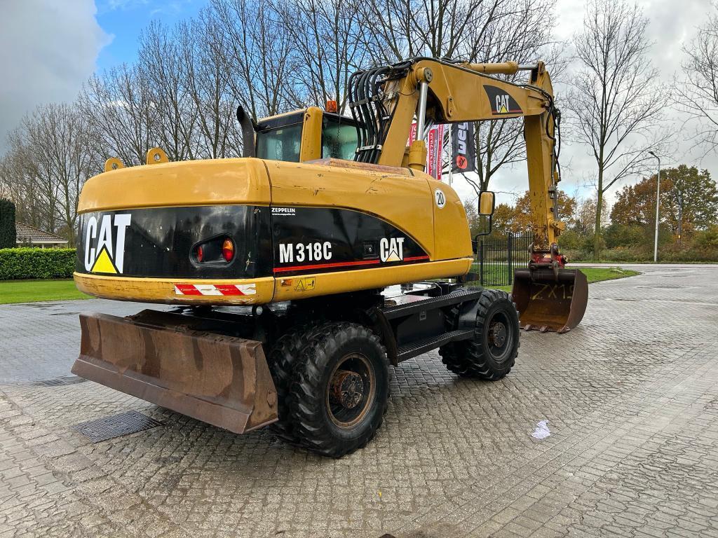 CATERPILLAR M318C wheel-type excavator