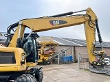 CATERPILLAR M320F wheel-type excavator