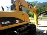 CATERPILLAR M318D wheel-type excavator